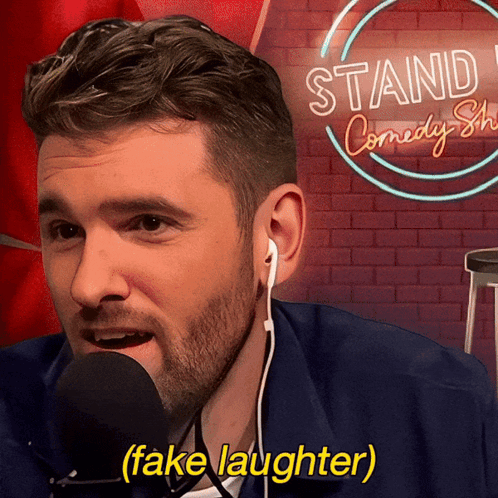 Man With Ear Buds Mic Stand Comedy Show