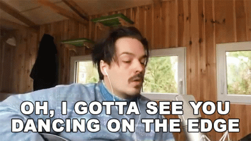 Man With Earbuds Saying Oh I Gotta See You Dancing On The Edge