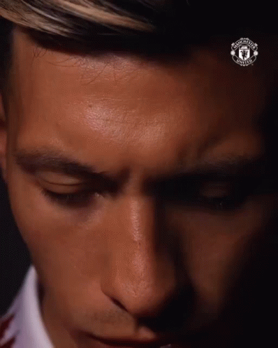 Man With Eyes Closed and Man United Logo