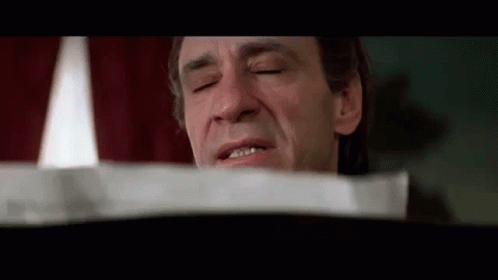 Man With Eyes Closed And Paper GIF