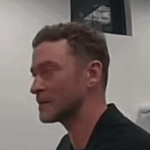 Man With Eyes Closed in Black Shirt