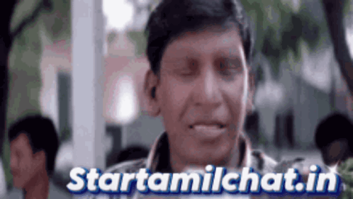 Man with Eyes Closed in Front of Startamilchat Sign