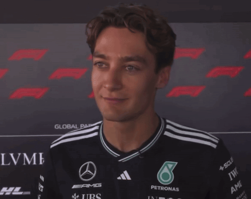 Man With Eyes Closed Wearing AMG Petronas Shirt