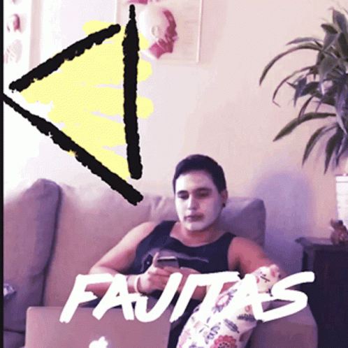 Man With Face Mask Sitting on Couch Saying Fajitas