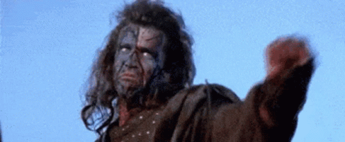 Man With Face Tattoo Fist In Air Blue Sky GIF