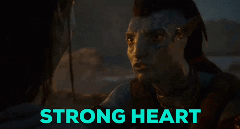 Man With Face Tattoo Looks at Another Saying Strong Heart