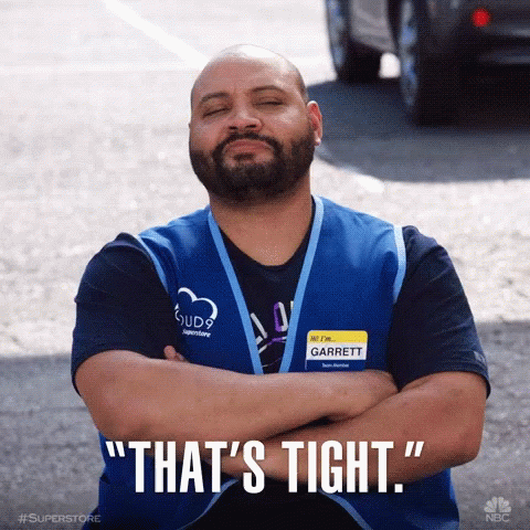 Man with Garrett Name Tag Crosses Arms