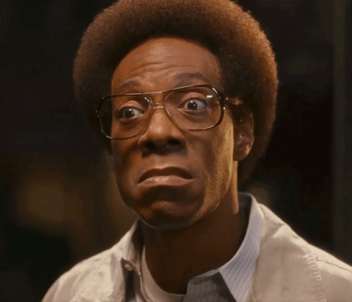 Man with Glasses and Afro Making Face