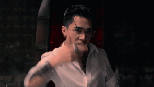 Man With Glasses and Arm Tattoo Making Funny Face
