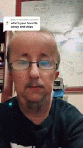 Man with Glasses and Beard at Whiteboard