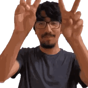 Man With Glasses and Beard Giving Peace Sign