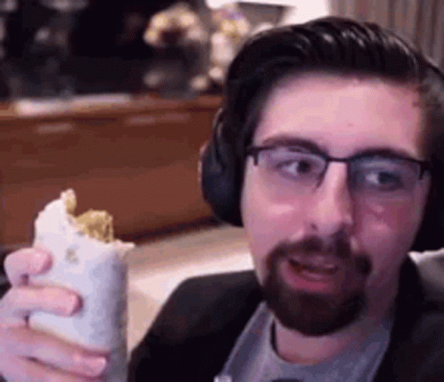 Man With Glasses And Beard Holding Burrito GIF