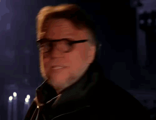 Man With Glasses and Beard Holding Nickelodeon Can
