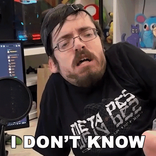 Man With Glasses and Beard in Black Shirt Saying I Don't Know