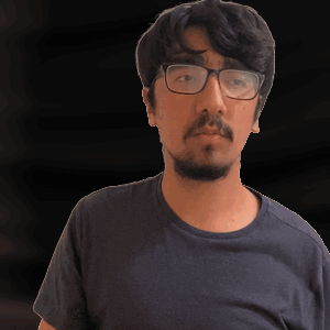 Man With Glasses and Beard in Blue Shirt