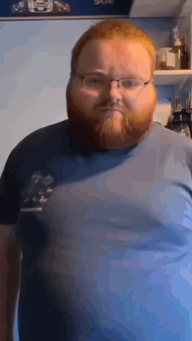 Man with Glasses and Beard in Blue Shirt