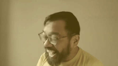 Man With Glasses and Beard Laughing