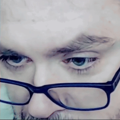 Man With Glasses and Beard Looking at Camera