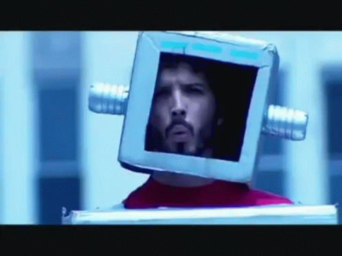Man With Glasses And Beard Looking At Reflection GIF