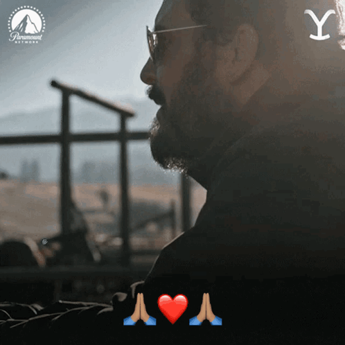 Man With Glasses And Beard Looking Out Window With Paramount Logo GIF