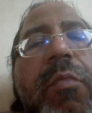 Man with Glasses and Beard Making Face