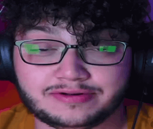 Man With Glasses And Beard Making Funny Face GIF