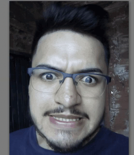 Man with Glasses and Beard Making Funny Face