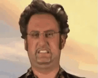Man With Glasses and Beard Making Funny Face