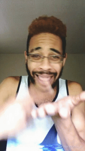 Man With Glasses and Beard Making Heart Hands