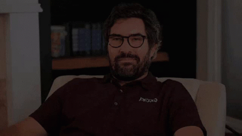 Man with Glasses and Beard Saying Hi There