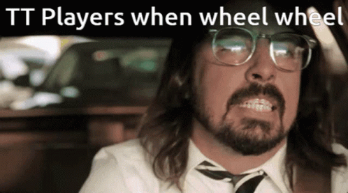Man With Glasses and Beard Saying Tt Players When Wheel Wheel