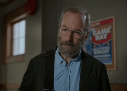Man With Glasses And Beard Saying Would You Accept An E-Middle Finger GIF