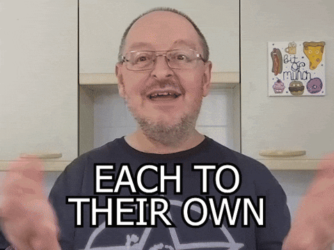 Man with Glasses and Beard Says Each to Their Own