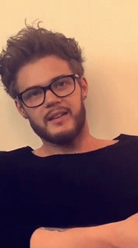 Man With Glasses and Beard Smiling