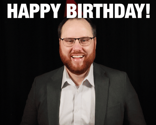 Man With Glasses And Beard Smiling Happy Birthday Sign GIF