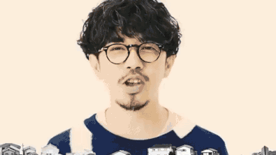 Man With Glasses And Beard Surrounded By Small Houses GIF