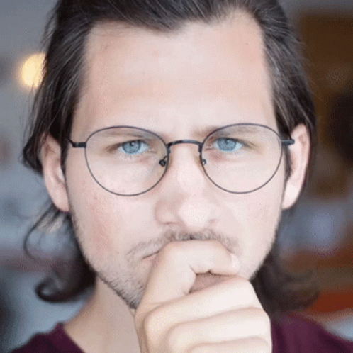Man with Glasses and Beard Thinking