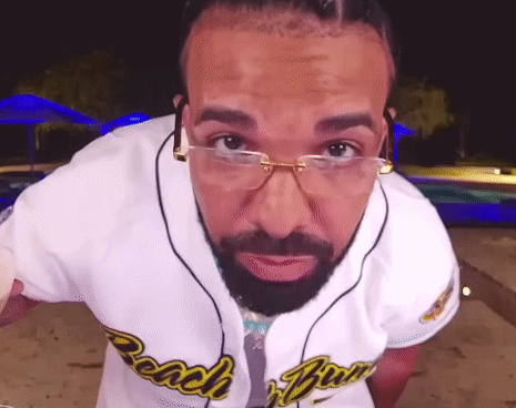 Man with Glasses and Beard Wearing Beach Boys Shirt