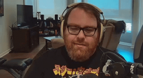 Man with Glasses and Beard Wearing Headphones