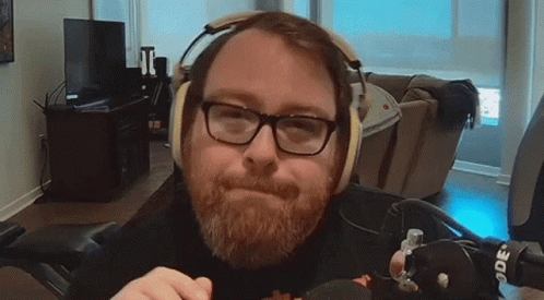 Man with Glasses and Beard Wearing Headphones