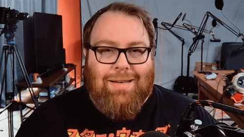 Man With Glasses And Beard Wearing Nintendo Shirt GIF