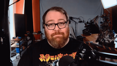 Man with Glasses and Beard Wearing Screw Shirt