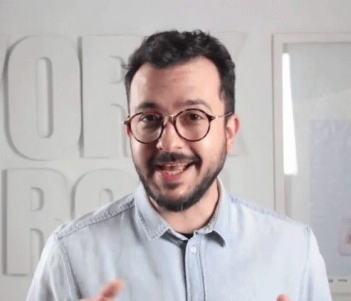 Man With Glasses And Blue Shirt Saying OE GIF