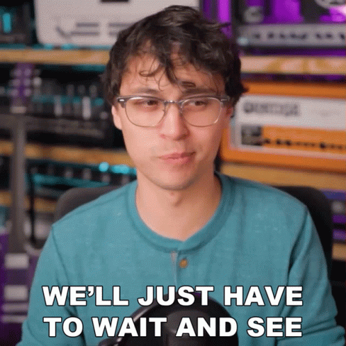 Man With Glasses and Blue Shirt Says We'll Just Have to Wait and See
