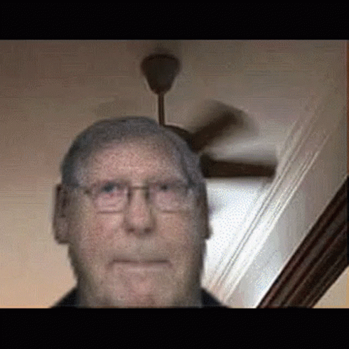Man With Glasses and Ceiling Fan