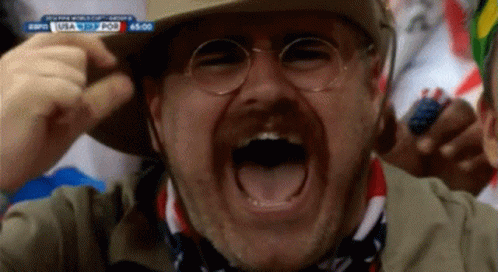 Man With Glasses and Cowboy Hat Screaming at ESPN