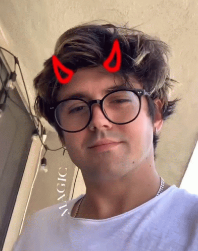 Man With Glasses And Devil Horns Saying Magic GIF