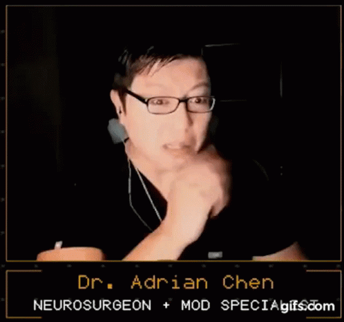 Man With Glasses and Ear Buds Talking to Dr. Adrian Chen