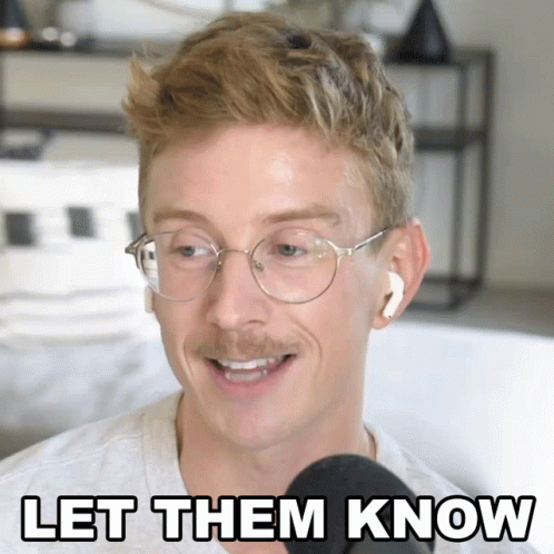 Man with Glasses and Earbuds Speaking