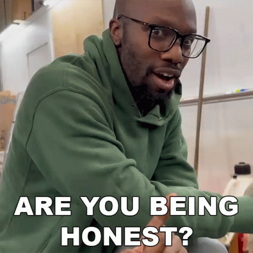 Man With Glasses and Green Hoodie Asking If Honest